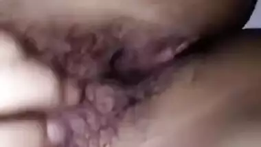 Indian girl slowly touches her small boobies and exposes hairy XXX pussy