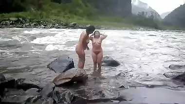 Two fat Desi women show their XXX assets while relaxing naked in river
