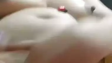 Chubby, young lady enjoys fingering her shaved pussy