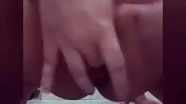 Excited Indian teen spreads legs and fingers XXX twat in quick sex video