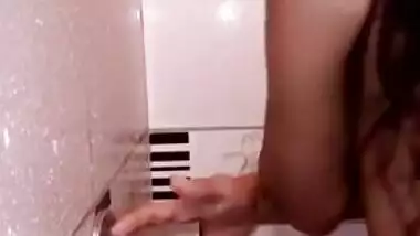 Teen Desi girl takes a shower and exposes her XXX tit and brown nipple