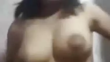 Sweet Desi gal sneaks in bathroom to show tits with big XXX nipples