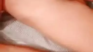 Indian couple lie next to each other and expose private body parts