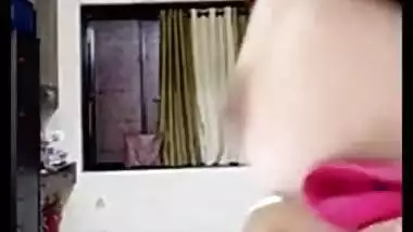Teen Indian sets the camera on and starts her XXX striptease show