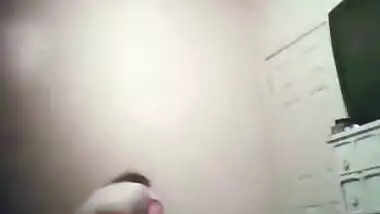 Watching her undress and show her big boobs