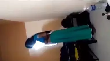 A desi aunty strips to seduce her lover in a Tamil aunty sex video